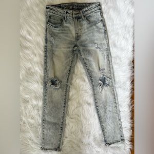 AMERICAN EAGLE Distressed flex skinny jeans